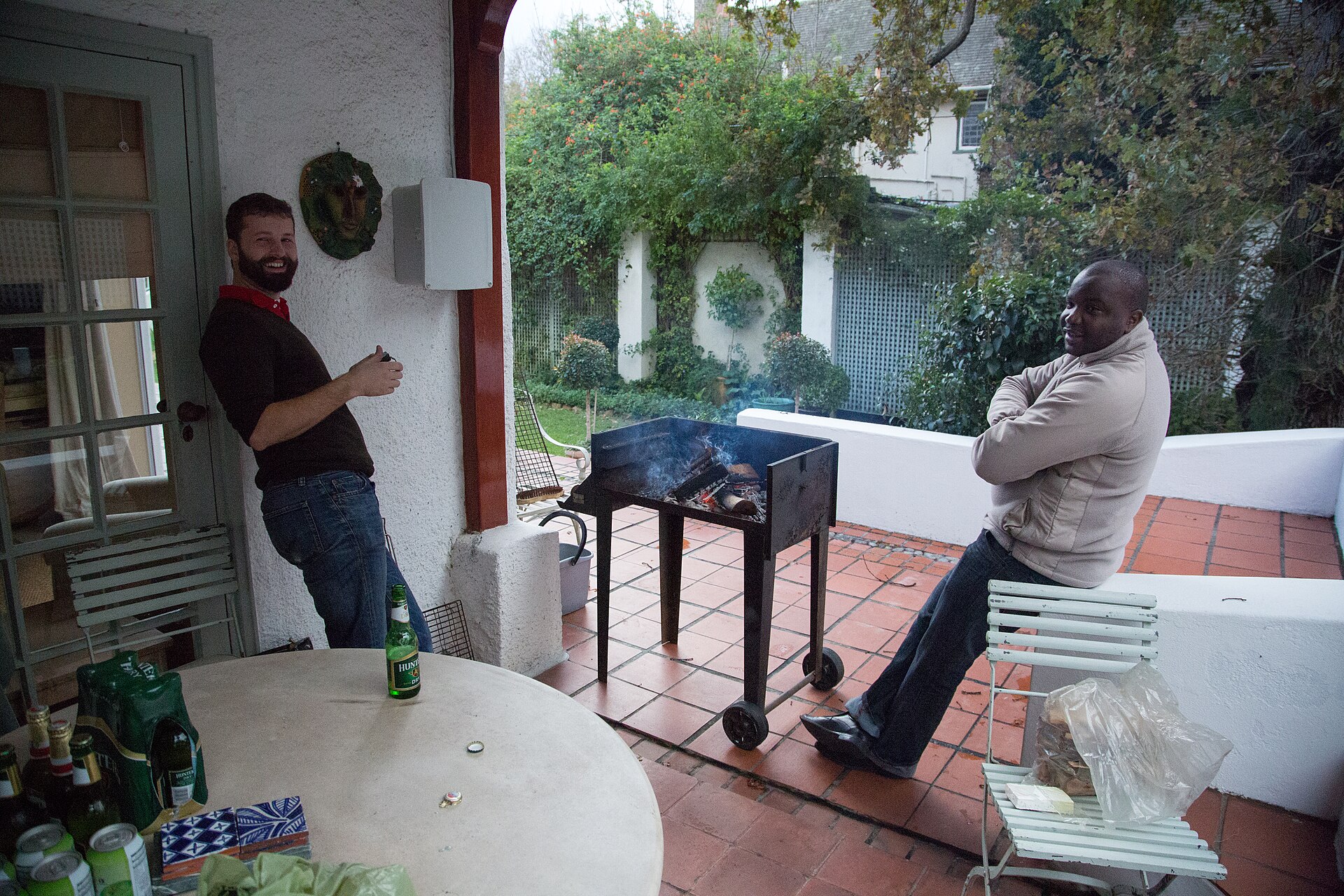 A traditional South African braai with meat over wood coals