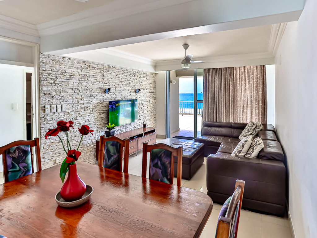 Open-plan dining and living area with ocean views in a Cyberview Letting apartment, Ballito