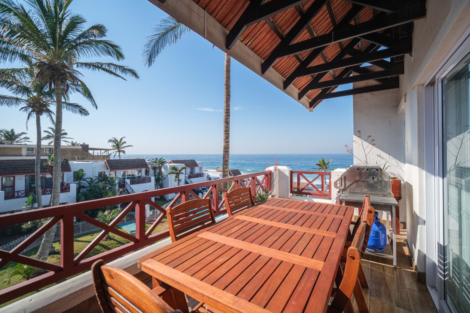 Le Paradis apartment complex and pool with palm trees in Ballito