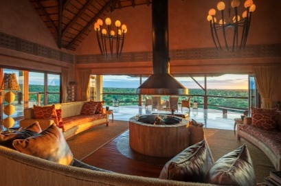 Makumu lounge with a central fireplace