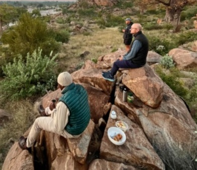 Travellers taking a break on a rocky outcrop