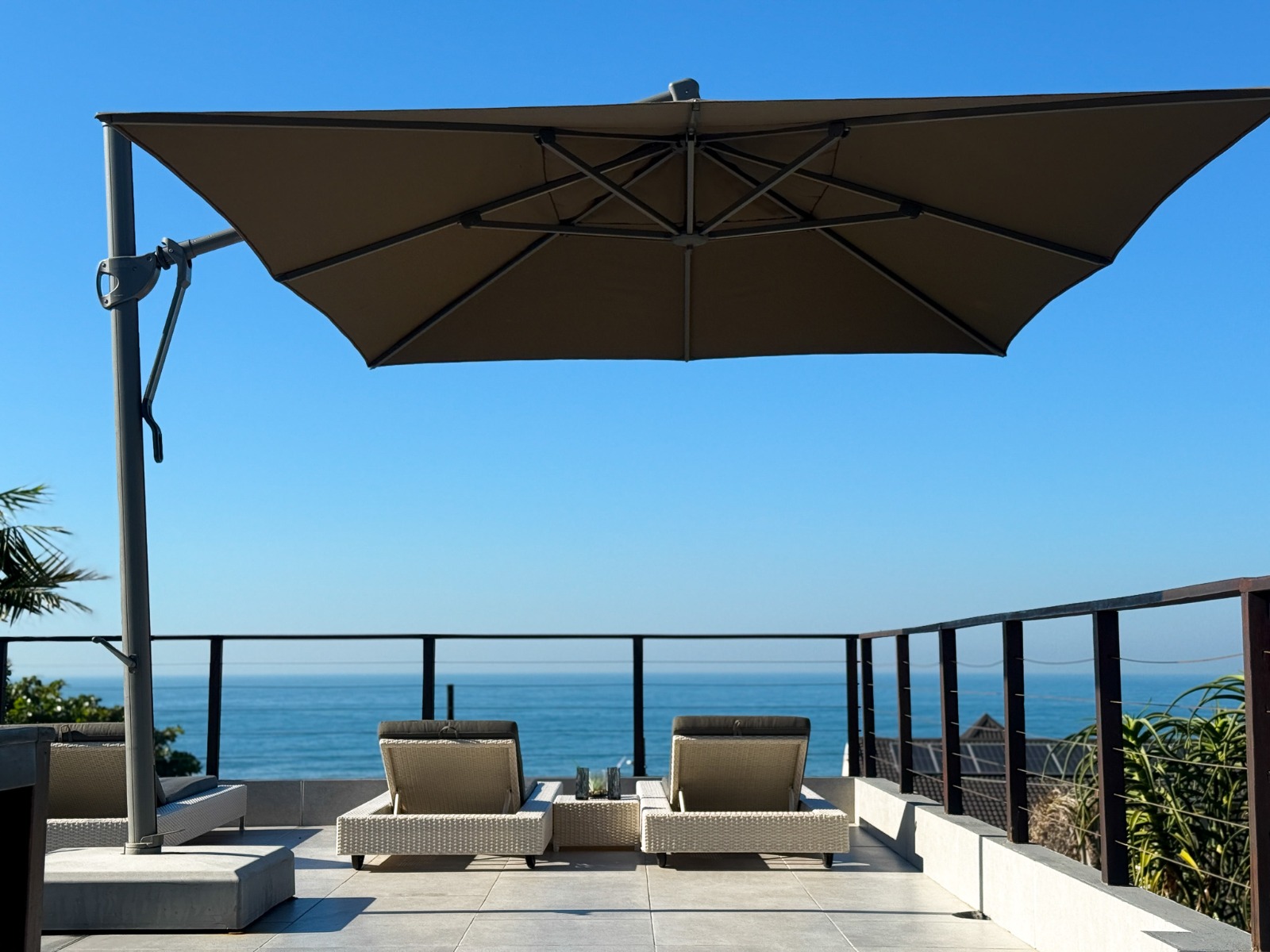 Umbrella and loungers with ocean views at Thirty Two B on Salmon Bay